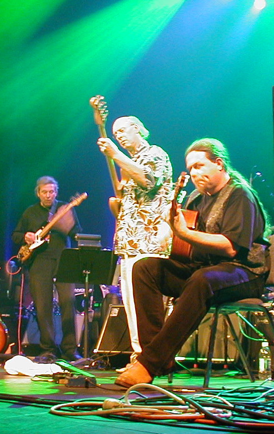 Phil Miller (L) on stage with Richard Sinclair and Fred T Baker at Progman 2003