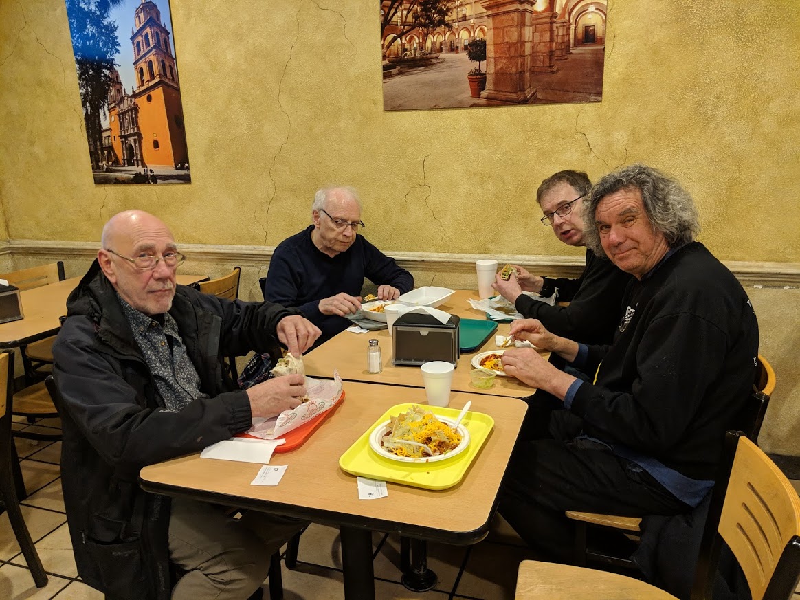 Members of Soft Machine at dinner. L-R: Roy Babbington, John Marshall, Theo Travis, John Etheriedge. Photo by Jon Davis